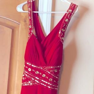 Full length (slight train) red backless prom dress. Stretch form fitting fabric.